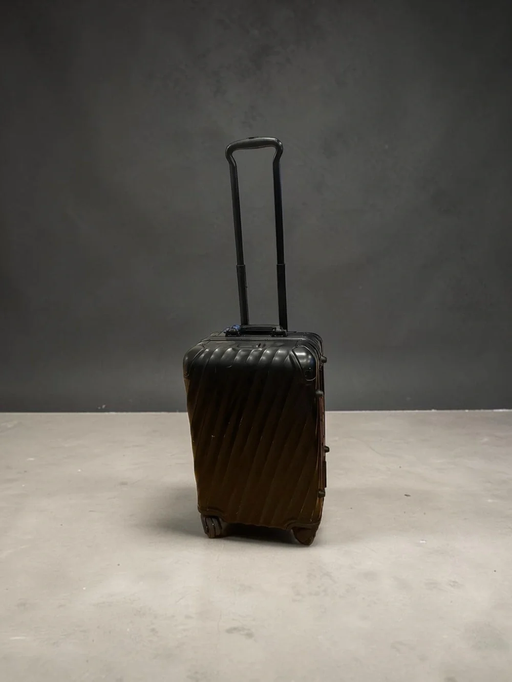 Tumi Black Diagonal-Rib Hard-Shell Spinner Carry-On